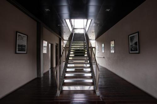 a long hallway with stairs in a building at Adonis Lyon Dock Ouest in Lyon