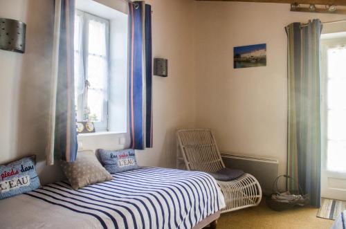 Ein Bett oder Betten in einem Zimmer der Unterkunft Logis Saint Léonard