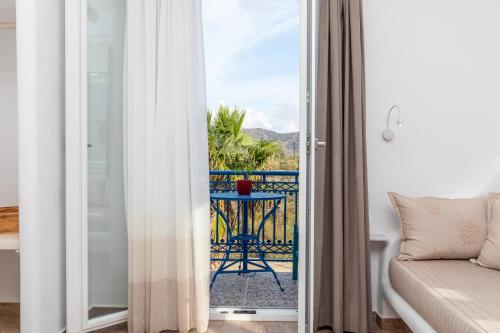 a room with a view of a balcony at Arhontiko in Naxos Chora