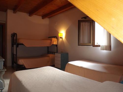 מיטה או מיטות בחדר ב-Hotel Shadows