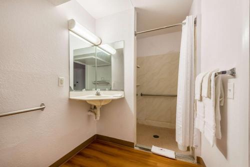 a bathroom with a sink and a mirror at Motel 6-Dayton, OH in Dayton