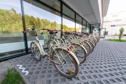 a row of bikes parked in front of a building at Blue Marine Mielno in Mielno