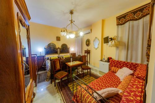 a living room with a couch and a table at Stanze Barocche in Modica