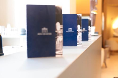 a counter in a store with blue signs on it at Hotel d'Alcantara in Tournai