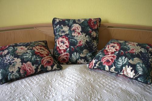 two pillows sitting on top of a bed at Brīvdienu dzīvoklis in Madona