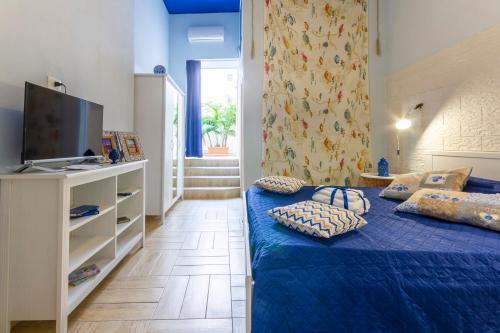 Municipio Apartments tesisinde bir odada yatak veya yataklar