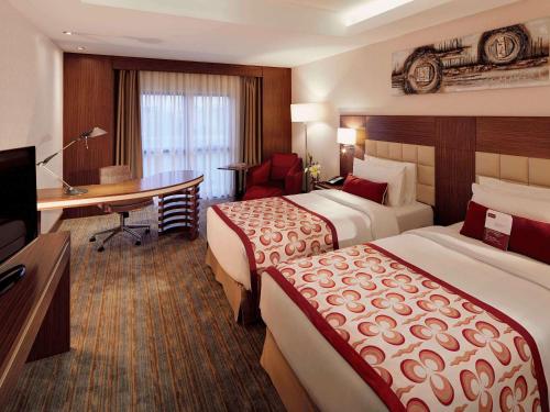 En eller flere senge i et værelse på Mercure Istanbul Altunizade