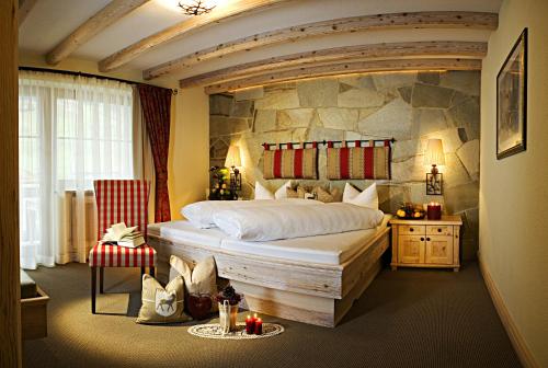 Postel nebo postele na pokoji v ubytování Boutique Hotel Montanara