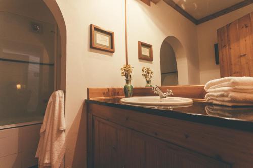 a bathroom with a sink and a mirror at BayView House in Angra do Heroísmo