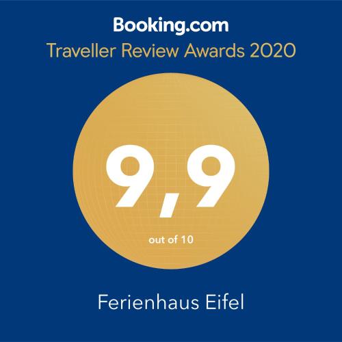 a yellow circle with the text travel review awards at Ferienhaus Eifel in Nettersheim
