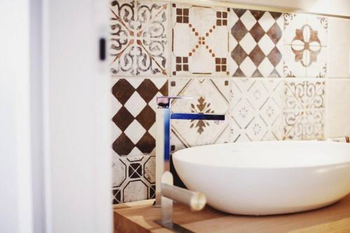 a bathroom with a white bowl on a wooden counter at Casa Luna in Santa Maria di Castellabate