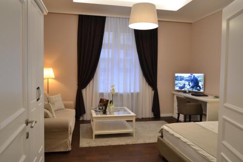 a hotel room with a bed and a desk at City Centre Dream place in Zagreb