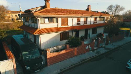 a van parked in front of a house at Anaelehouserooms LTB in Arborea 