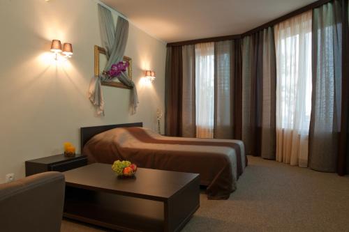 En eller flere senge i et værelse på Villa Svetlana