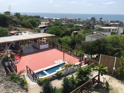 an aerial view of a house with a swimming pool at The Heights in Montañita in Montañita