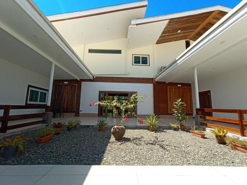 a courtyard of a house with potted plants at San Pedro Country Farm Resort and Event Center Inc in Cantilan