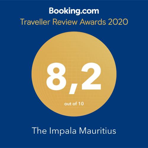 een gele cirkel met de prijzen voor de beoordeling van tekstreizen en de impala marinirus bij The Impala holiday flat Mon Choisy -Trou aux biches in Mont Choisy