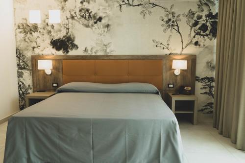 Hotel Pontemare tesisinde bir odada yatak veya yataklar