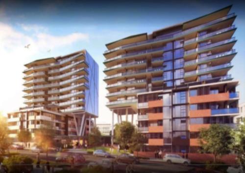 a rendering of two tall buildings in a city at Arena Convenient 2 Bedroom in Brisbane
