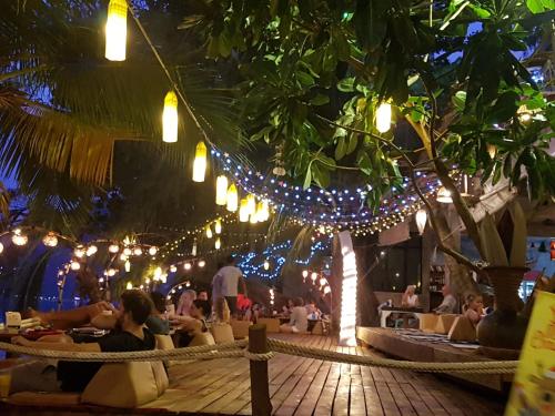 people sitting at tables in a restaurant at In Touch Resort in Ko Tao