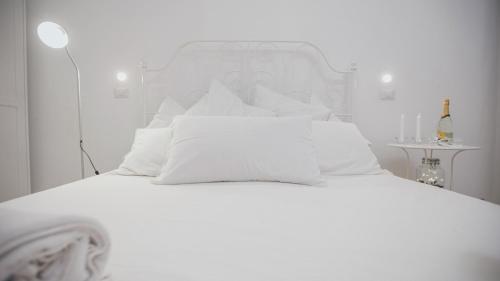 A bed or beds in a room at Cortile Oliva