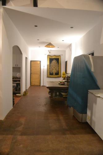a long hallway with a table in a room at Homebar in Ko Chang
