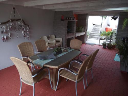 a dining room with a table and chairs at 19 Richthofen in Swakopmund