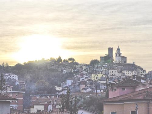 a town on top of a hill with a castle at Borgo degli Angeli Arcola in Arcola