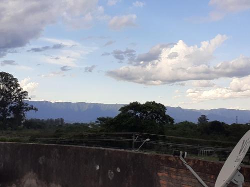a view of the mountains from the top of a wall at POUSADA PERLLA's Pindamonhangaba in Pindamonhangaba