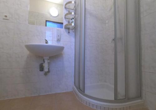 Koupelna v ubytování Penzion Mlýnický Dvůr