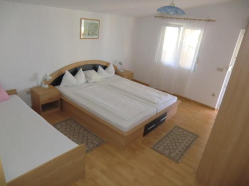 Posteľ alebo postele v izbe v ubytovaní Ferien Haus Evita auf Insel Vir - Wohnung I