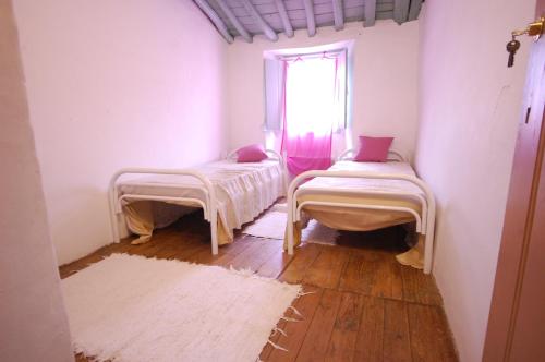 Ένα ή περισσότερα κρεβάτια σε δωμάτιο στο Hostel Portalegre