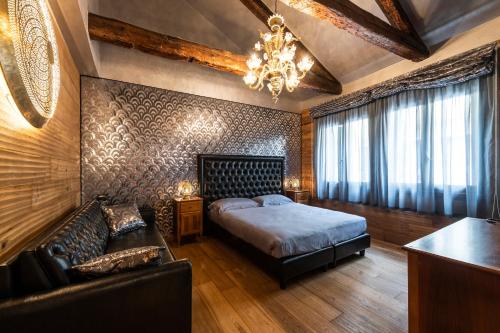 Una cama o camas en una habitación de Hotel Abbazia