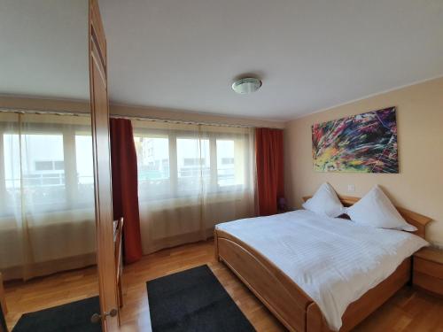 Postel nebo postele na pokoji v ubytování Le Merle Châtelain