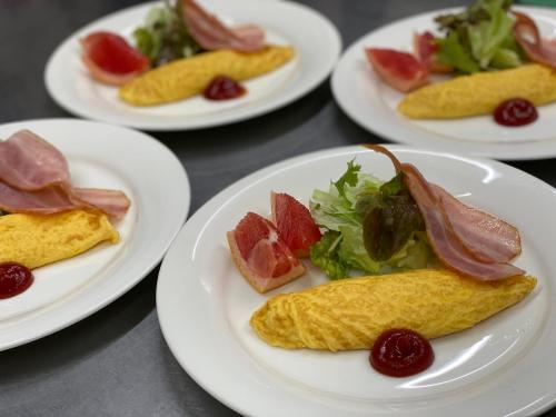 a group of plates of food on a table at Landhaus Dancru Netz in Hakuba