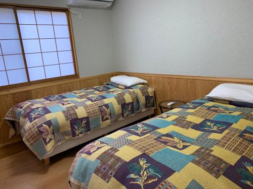 Cama o camas de una habitación en Annex Turtle Hotori-An