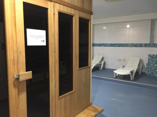 a door in a room with a waiting room at Hotel San Millán in Santander