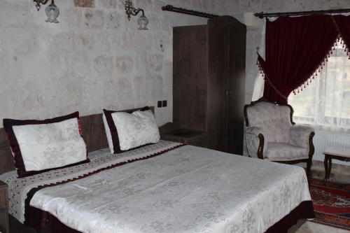 Katil atau katil-katil dalam bilik di Dilek Tepesi Cave Hotel