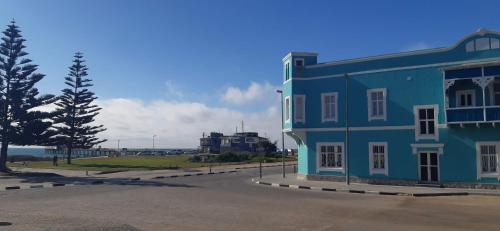 a blue building on the side of a street at Jetty Self-Catering in Swakopmund