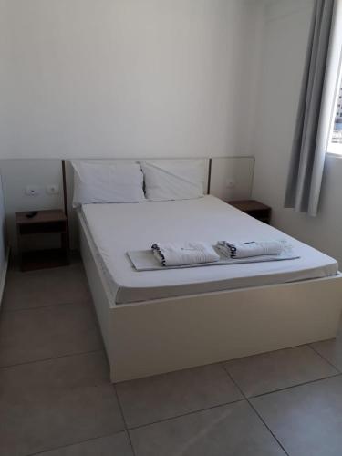 Postel nebo postele na pokoji v ubytování Hotel Lisboa