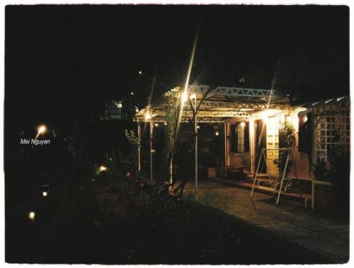 a house lit up at night with lights at Dalat Terrasse Des Roses Villa in Da Lat
