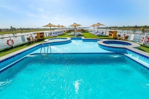 a pool at a resort with blue water at MS Chateau Lafayette Nile Cruise - 4 nights from Luxor each Monday and 3 nights from Aswan each Friday in Luxor