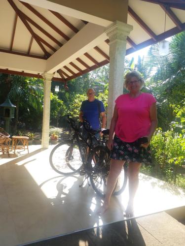 a man and a woman standing next to bikes at CASA VACANSA HOME STAY in Hungama