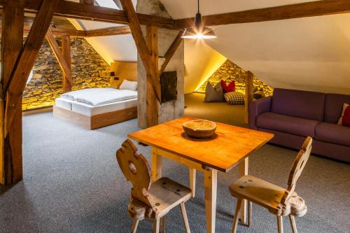 a room with a bed and a table and chairs at Josephus in Senales