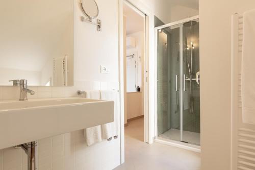 a bathroom with a sink and a shower at Albergo Punta de l'Est in Francavilla al Mare