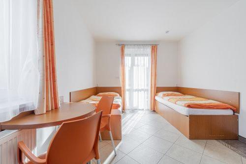 Lova arba lovos apgyvendinimo įstaigoje Apartmány Pod Sjezdovkou