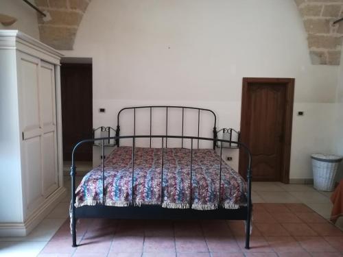 Katil atau katil-katil dalam bilik di Masseria Caracci