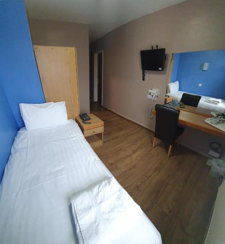 Cama o camas de una habitación en Gilson Hotel