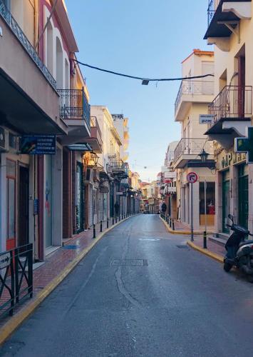 an empty street in a city with buildings at Filoxenia Hotel in Chios