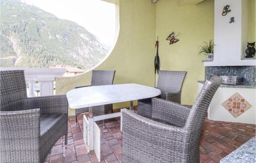a dining room with chairs and a table and a fireplace at Helle Ferienwohnung In Elmen in Elmen